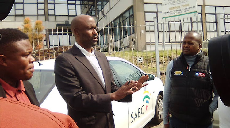 Eastern Cape department of health communications director Siyanda Manana speaks to members of the media waiting outside while parents of teenagers killed in the Enyobeni tavern tragedy are locked in a private meeting where officials have promised to release the final cause of death.