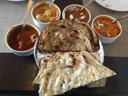 Butter Chk Half+Dal Makhni +2 Garlic Naan+4 Roti+1 Rice +sweet