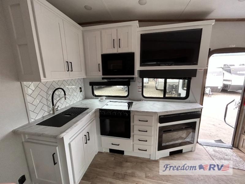 The kitchen and this RV provide plenty of counter space and luxury appliances.