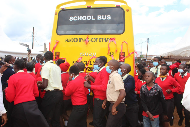 Kiahagu Day Secondary school students celebrate after they received a school bus procured using Othaya NG-CDF in Othaya town on Friday, October 16..