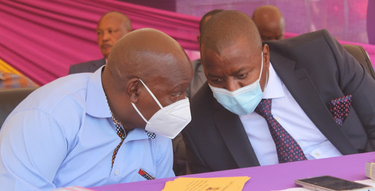 Nyeri Governor Mutahi Kahiga with Newfortis Sacco chairman John Githinji during the Sacco AGM at Nyamachaki Primary School in Nyeri town on Saturday.