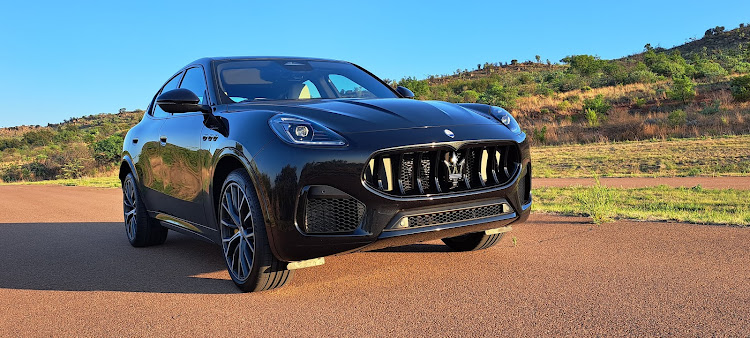 The black, toothy grille is low and imposing and the front fenders have Maserati’s signature triple portals.