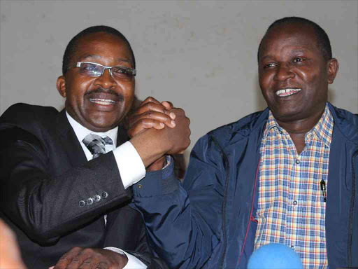 Governor Mwangi wa Iria and Kigumo MP Jamleck Kamau shaking hands during the Jubilee party interim officials' elections at Murang'a Teachers' College on last Tuesday.Photo Alice Waithera