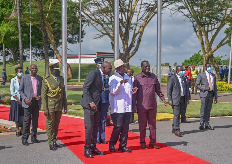 Transport CS Kipchumba Murkomen and Azimio la Umoja leader Raila Odinga see off Uganda's President Yoweri Museveni after his three day State visit on May 17, 2024.