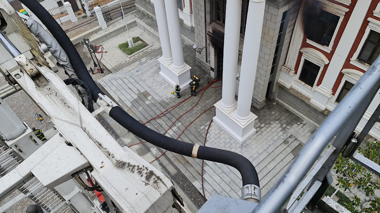 An aerial view of efforts to contain the blaze at parliament in CT