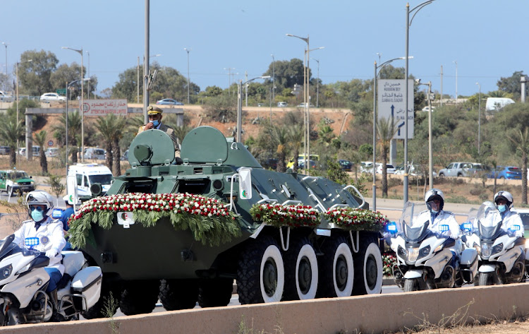 A convoy transporting the coffin of former Algerian president Abdelaziz Bouteflika heads towards El Alia cemetery, in Algiers, Algeria, September 19 2021. Picture: REUTERS/RAMZI BOUDINA
