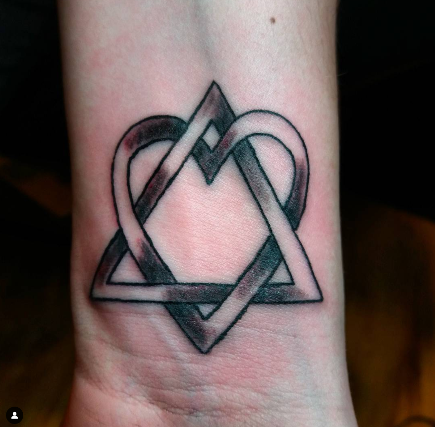 detailed adoption symbol tattoo