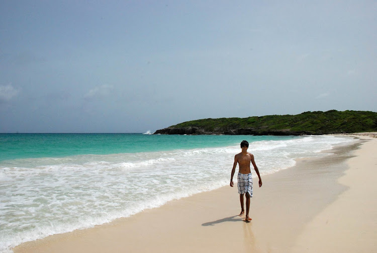 Walking an isolated beach on Vieques Island in Puerto Rico. 