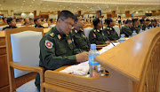 Myanmar military representatives attend the union parliament opening session in Naypyidaw on July 4, 2012.