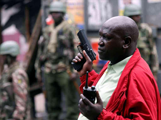 A policeman holds a gun during a protest by supporters of opposition leader Raila Odinga, in Mathare, in Nairobi, Kenya August 12, 2017. REUTERS