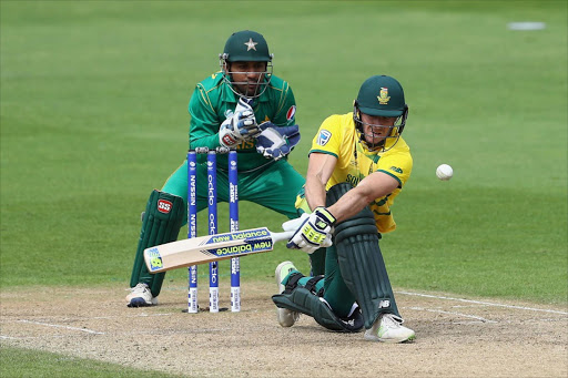 David Miller of South Africa sweeps as wicketkeeper Sarfraz Ahmed of Pakistan looks on during the ICC Champions Trophy match between Pakistan and South Africa at Edgbaston on June 7, 2017 in Birmingham, England.