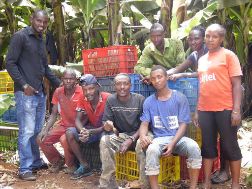 Youth posing for a picture at a banana farm in Mitunguu, Meru County, Kenya, February 10, 2018. /THOMSON REUTERS FOUNDATION