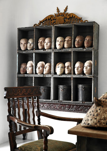 A collection of heads make for an interesting wall-art display.