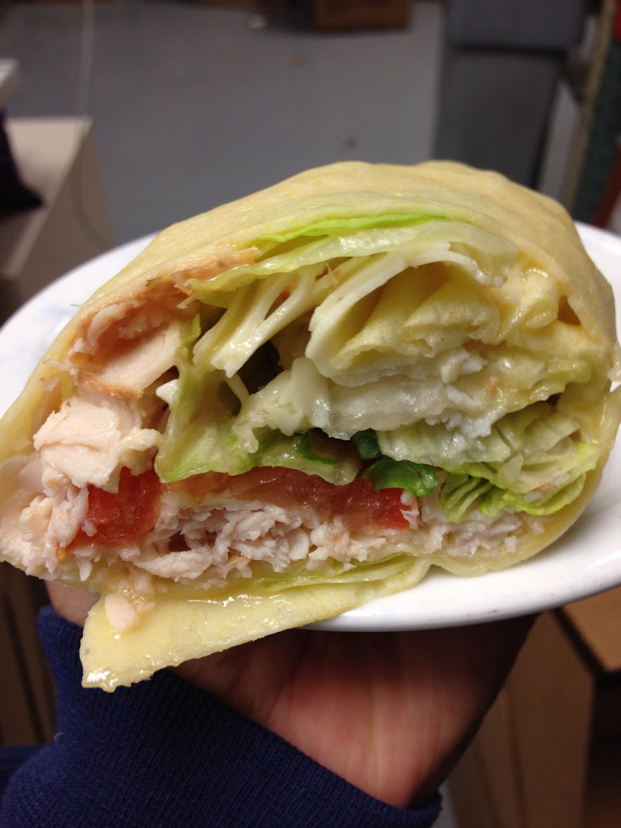 Turkey wrap with cheese, lettuce, tomato and Italian dressing