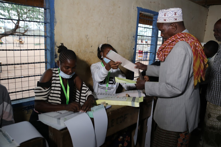 A Resident of Tana River goes through the process of voting in Handampya Primary School.