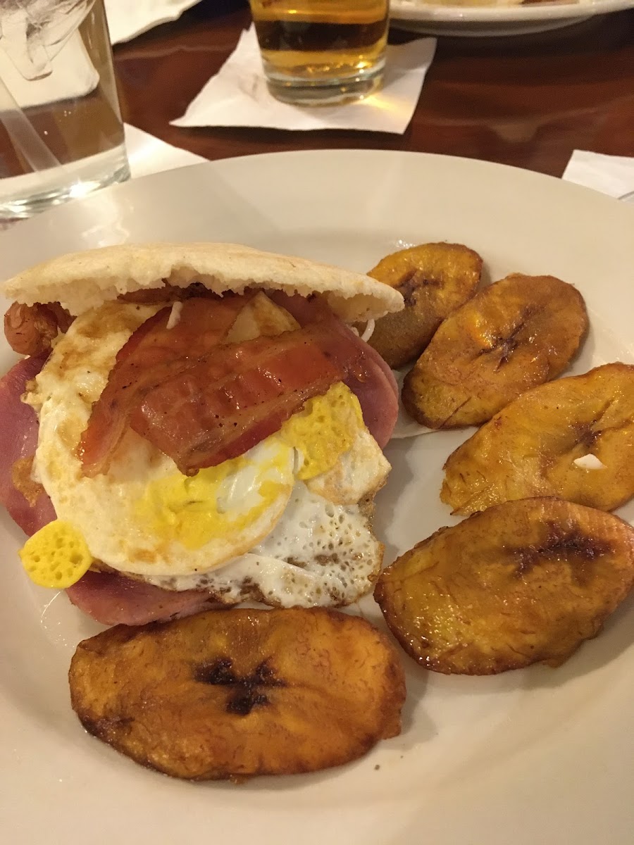 Arepa with egg, bacon, ham and cheese plus plantains