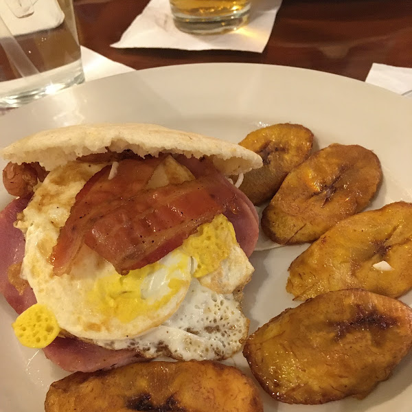 Arepa with egg, bacon, ham and cheese plus plantains