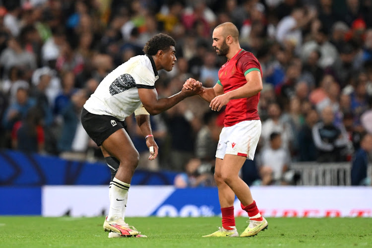 Vinaya Habosi of Fiji and Samuel Marques of Portugal shake hands at full time after the Rugby World Cup pool C match at Stadium de Toulouse on Sunday night.