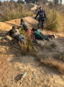 A total of 65 people were arrested when police conducted an operation in mountains and bushes close to a disused mine where eight women were gang-raped in Krugersdorp on Thursday,. 