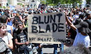 Students protest outside the parliament precinct before forcing their way through the gates of parliament on October 21, 2015 in Cape Town, South Africa. File photo.