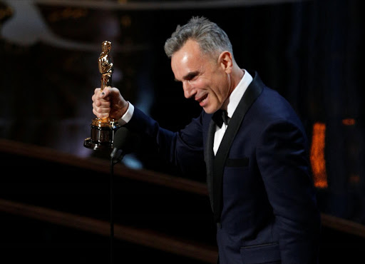 Daniel Day Lewis accepts the Oscar for best actor for his role in "Lincoln," at the 85th Academy Awards in Hollywood, California, February 24, 2013. / REUTERS/Mario Anzuoni/File Photo