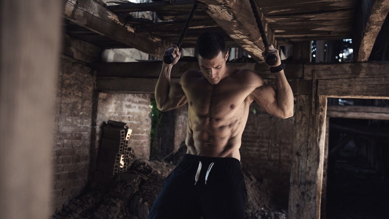 A man perform pull-ups in neutral position, meaning there is no internal or external rotation in his shoulders.