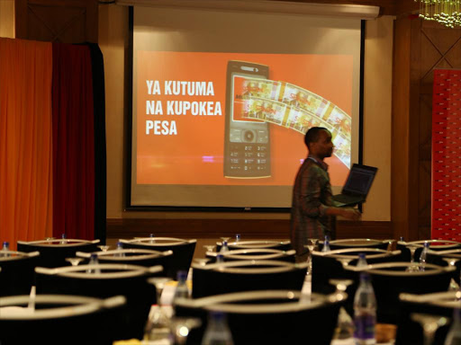 A technician at the Intercontinental Hotel on May 30,2014, before the launch of Mobikash, an integrated mobile banking and money transfer system /HEZRON NJOROGE