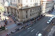 A long line of voters snakes around the Gauteng Provincial Legislature in Johannesburg to cast their votes on May 29 2024.