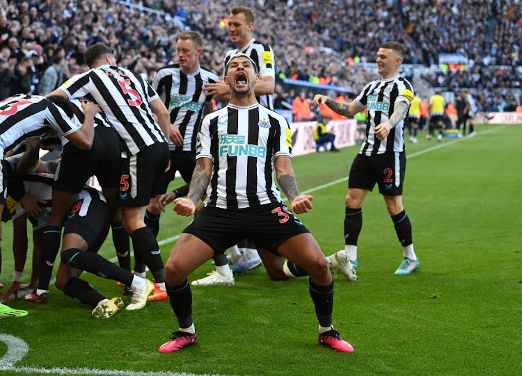 Newcastle player Bruno Guimaraes celebrates with teammates after their first goal in the Premier League match at St James Park in Newcastle upon Tyne on April 2 2023.