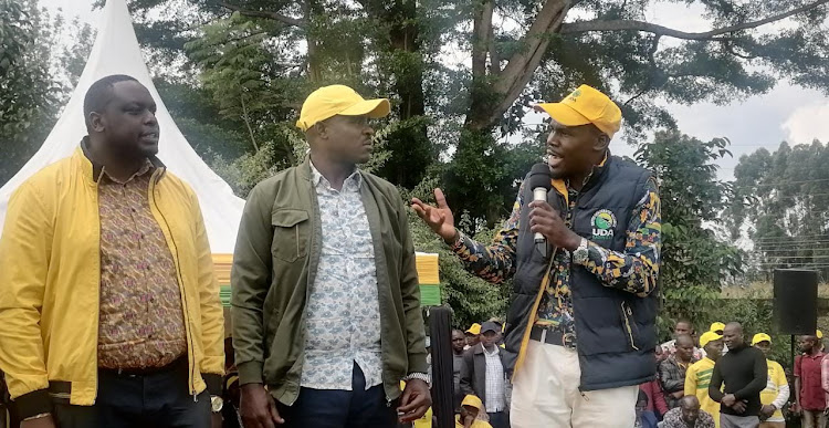 Kitutu Chache North MP Japhet Nyakundi, UDA Secretary General Cleophas Malala and South Mugirango MP, also House Majority Chief Whip Sylvanus Osoro during a party membership recruitment drive in Kitutu Chache South on Monday (IMAGE BY MAGATI OBEBO)