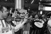 20100608 BMA Mexican fans performing on arrivil at the O.R Tambo International Airport and were looking forward to the opening match against Bafana Bafana. PIC: BAFANA MAHLANGU. 08/06/2010. © SOWETAN