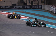 Verstappen chases seven-times world champion Hamilton on the last lap of their winner-takes-all battle.