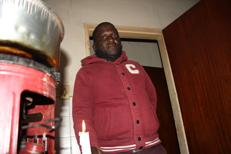 Ncora Private School technology teacher Justice Chidehindi readies to prepare his meal using a paraffin stove at his residence, which also does not have electricity.