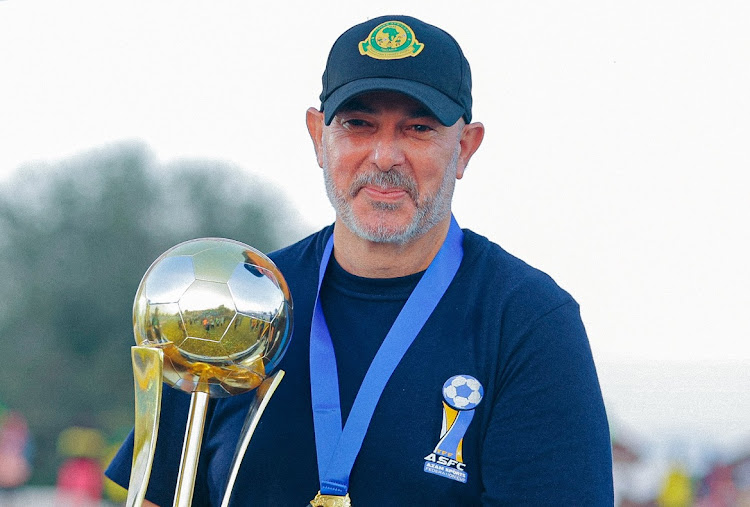 Tunisian coach Nasreddine Nabi poses with the Azam Sports Federation Cup he won with Tanzania's Young Africans in the final against Azam FC on June 12 2023.