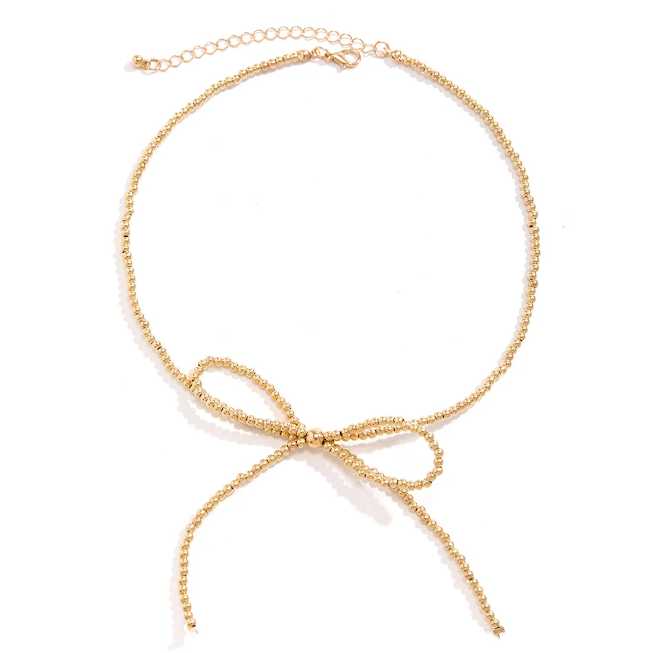 Conjunto de brincos, pulseira e colar com laço de nós e contas de nicho. Adicione um toque artesanal e sofisticado ao seu visual diário, destacando sua beleza.