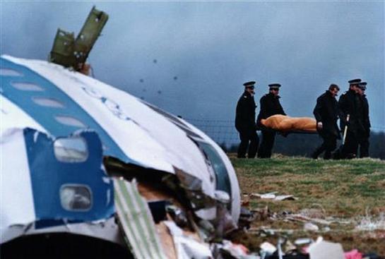 Rescue personnel carry a body away from the site of the Pan Am Flight 103 crash in the Scottish town of Lockerbie in December 1988. Picture: REUTERS