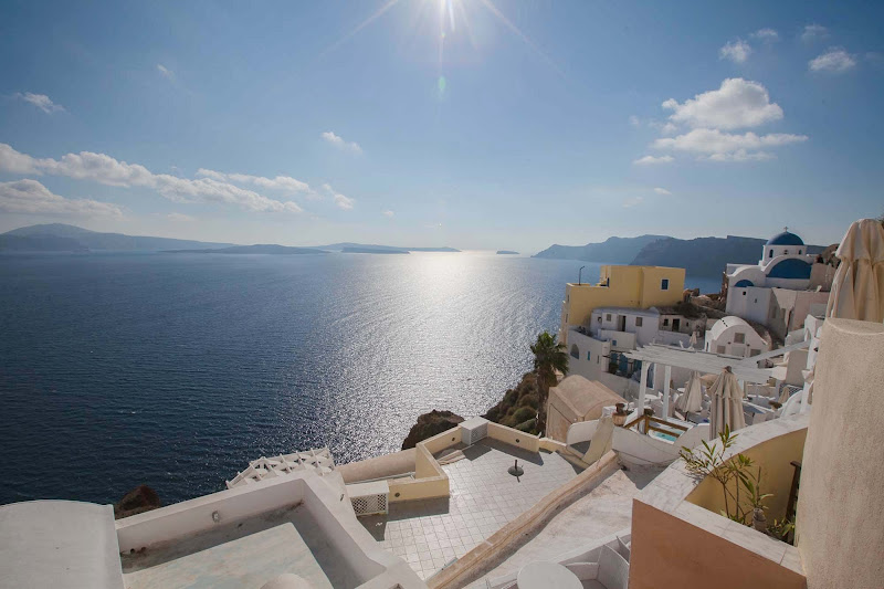 Overlooking the sugarcube houses and shimmering bay in Oia on the Greek island of Santorini. 