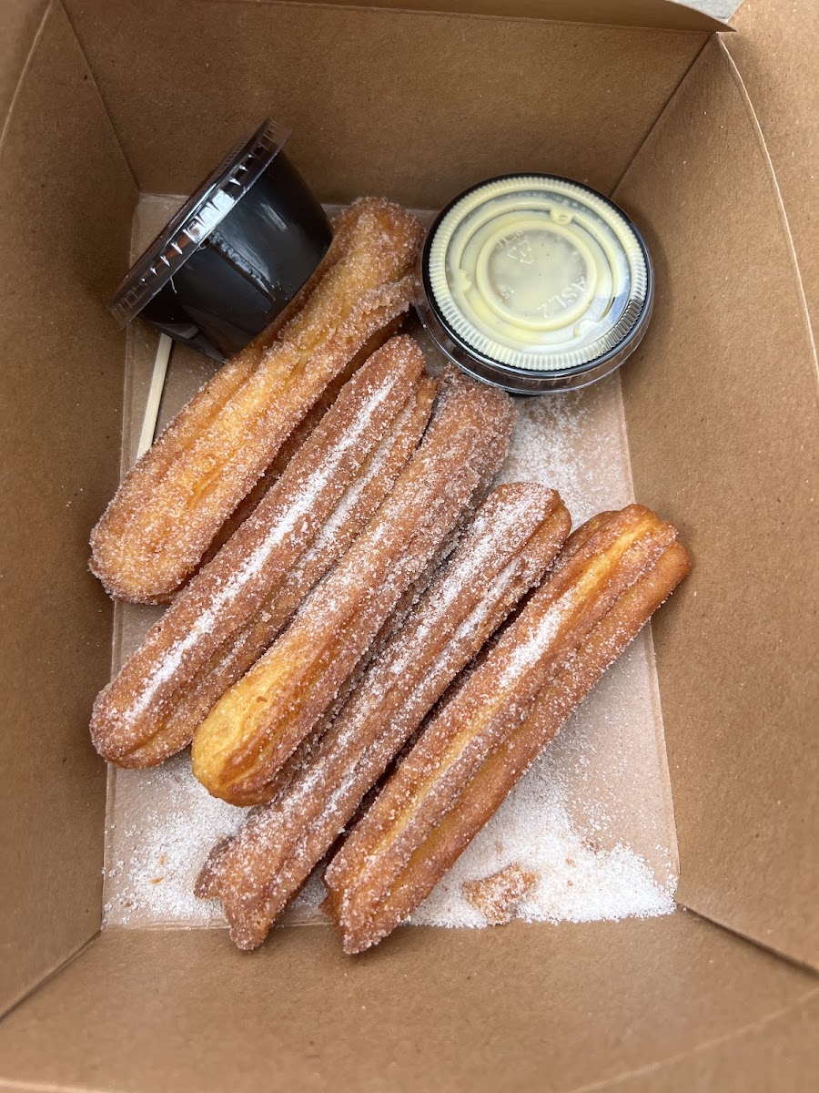 GF churros with chocolate and vanillia cream sauce