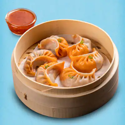 Steamed Schezwan Chicken Momos With Momo Chutney