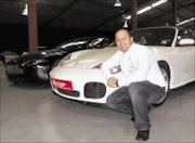 CHOICE: Shannon Winterstein with some of the 'supercars' to be auctioned.