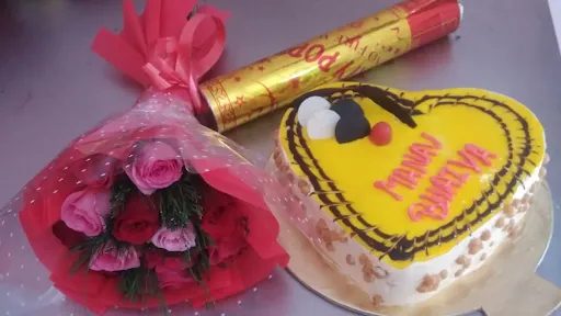 1 Butterscotch Heart Shape Cake With Party Popar And 10 Rose Bunch