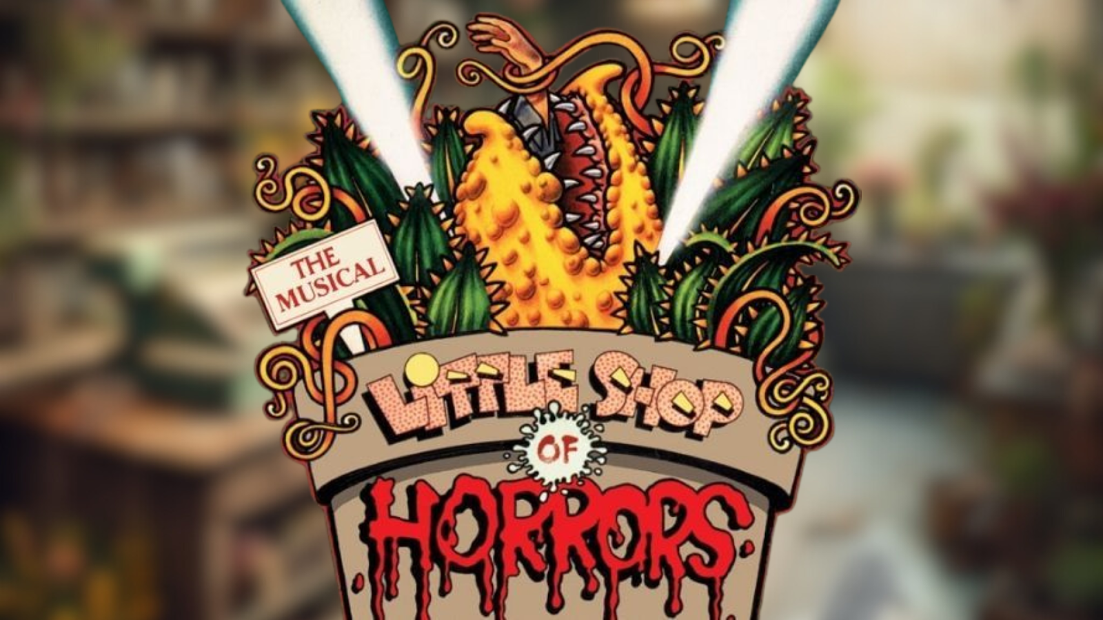 Giant Venus flytrap plant in vintage flower shop for Little Shop of Horrors at Flowertown Players Summerville.