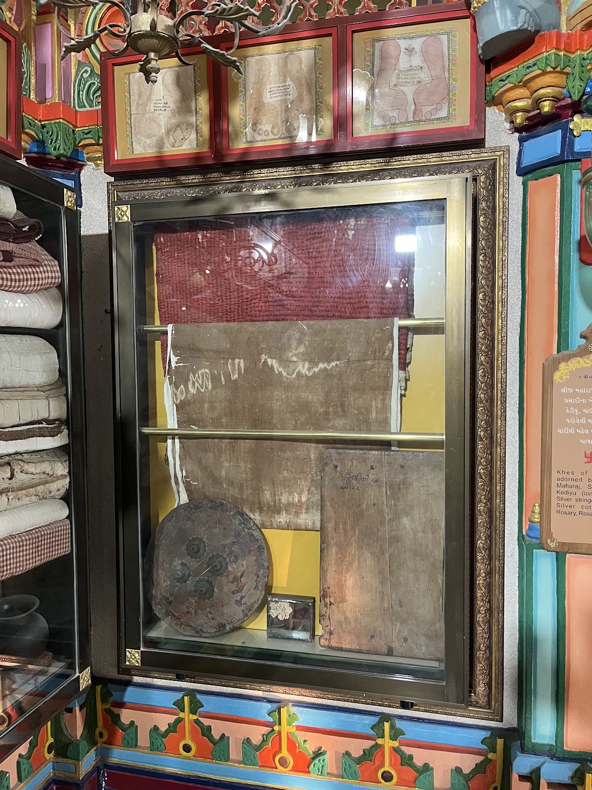 Prasadi clothing and shield gifted by Punjabhai to Shree Hari