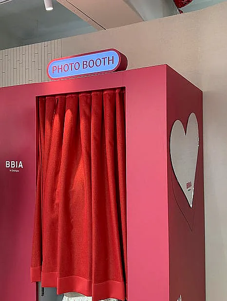 alt='Customers actively trying out makeup products at a testing station within the BBIA Seongsu store'