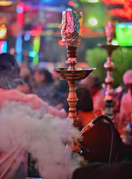 Shisha pots are seen in use at a nightclub in Nairobi