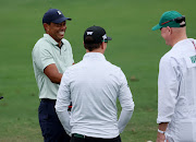 Tiger Woods of the U.S. and Zach Johnson of the U.S. on the practice tee.