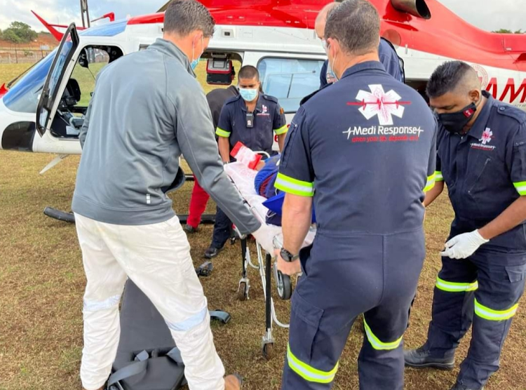 A man is being airlifted to hospital after a driver accidentally drove over him at a Ballito carwash.