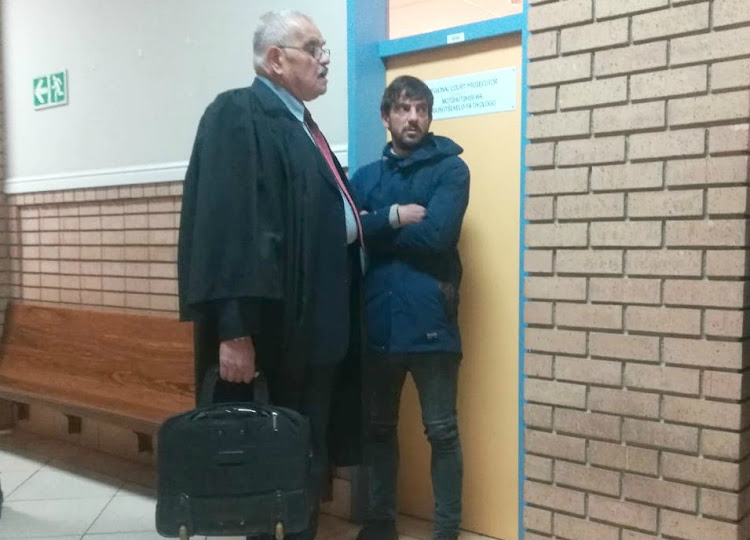 Adam Catzavelos, right, apologised on Thursday outside the Randburg Magistrate's Court for using the k-word in a video he posted from Greece.