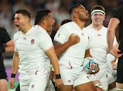 England players celebrate after defeating champions New Zealand to advance to the Rugby World Cup final. 