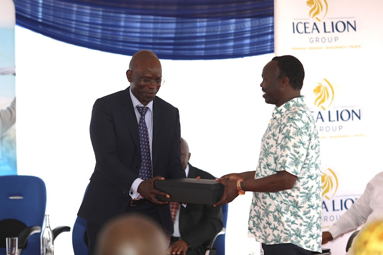 ICEA Group CEO Philip Lopokoiyit and IRA Commissioner of Insurance Godfrey Kiptum during the opening of ICEA LION Group’s new branch located at Acacia Centre, Mezzanine 2, on Nyerere Road.